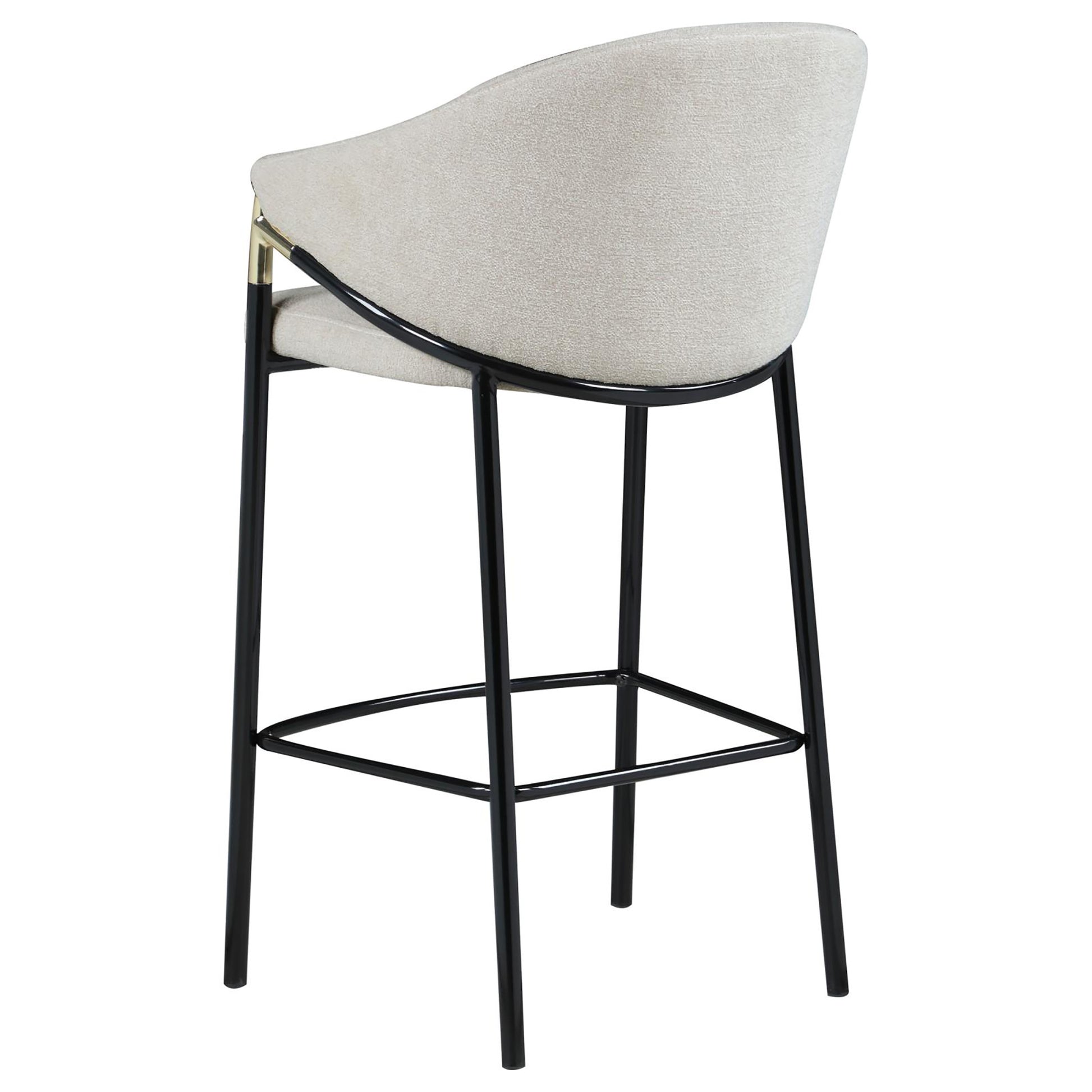 Cream textured fabric bar stool with black metal legs and gold accents