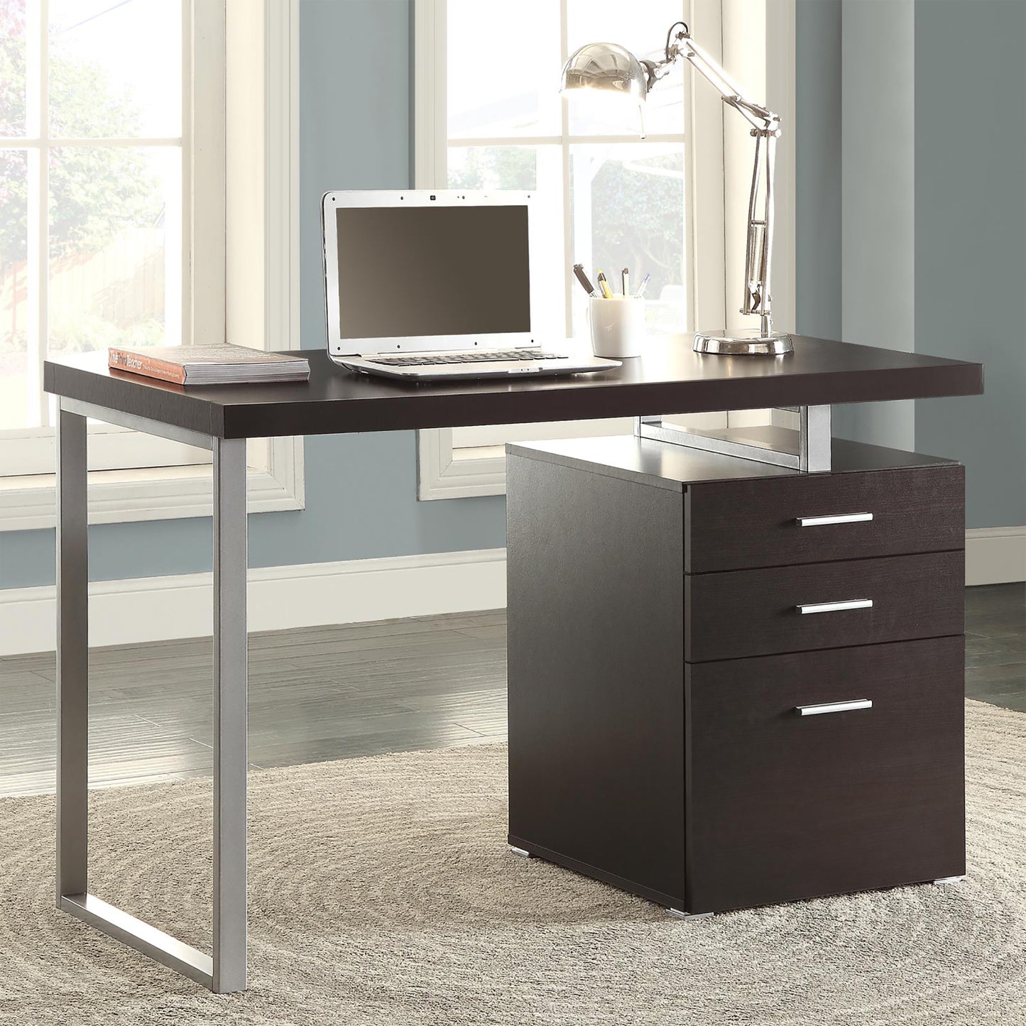 Modern dark wood desk with silver metal legs and a threedrawer filing cabinet