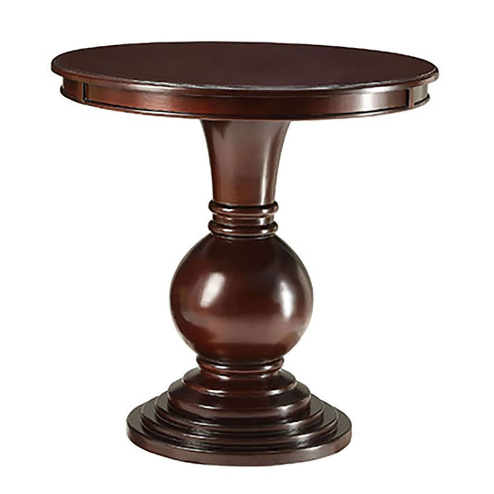 Ornate dark wood accent table with a round top and a sculpted pedestal base
