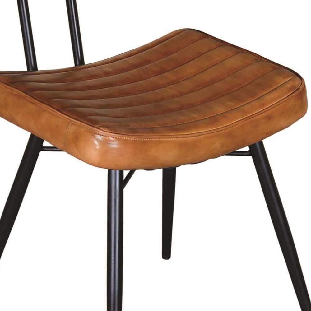 Tan leather bar stool with quilted seat and black metal legs for modern kitchens