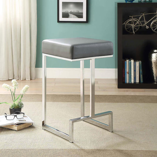 Gray faux leather bar stool with a polished chrome frame ideal for modern kitchens