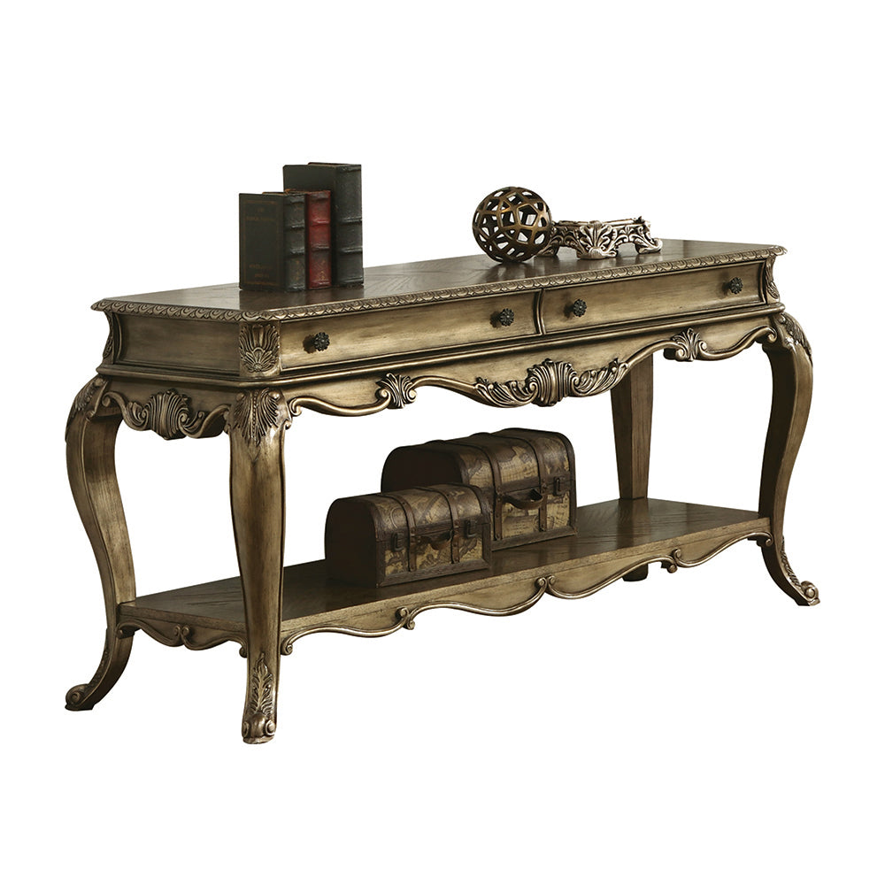 Ornate antique gold console table with two drawers and decorative carvings