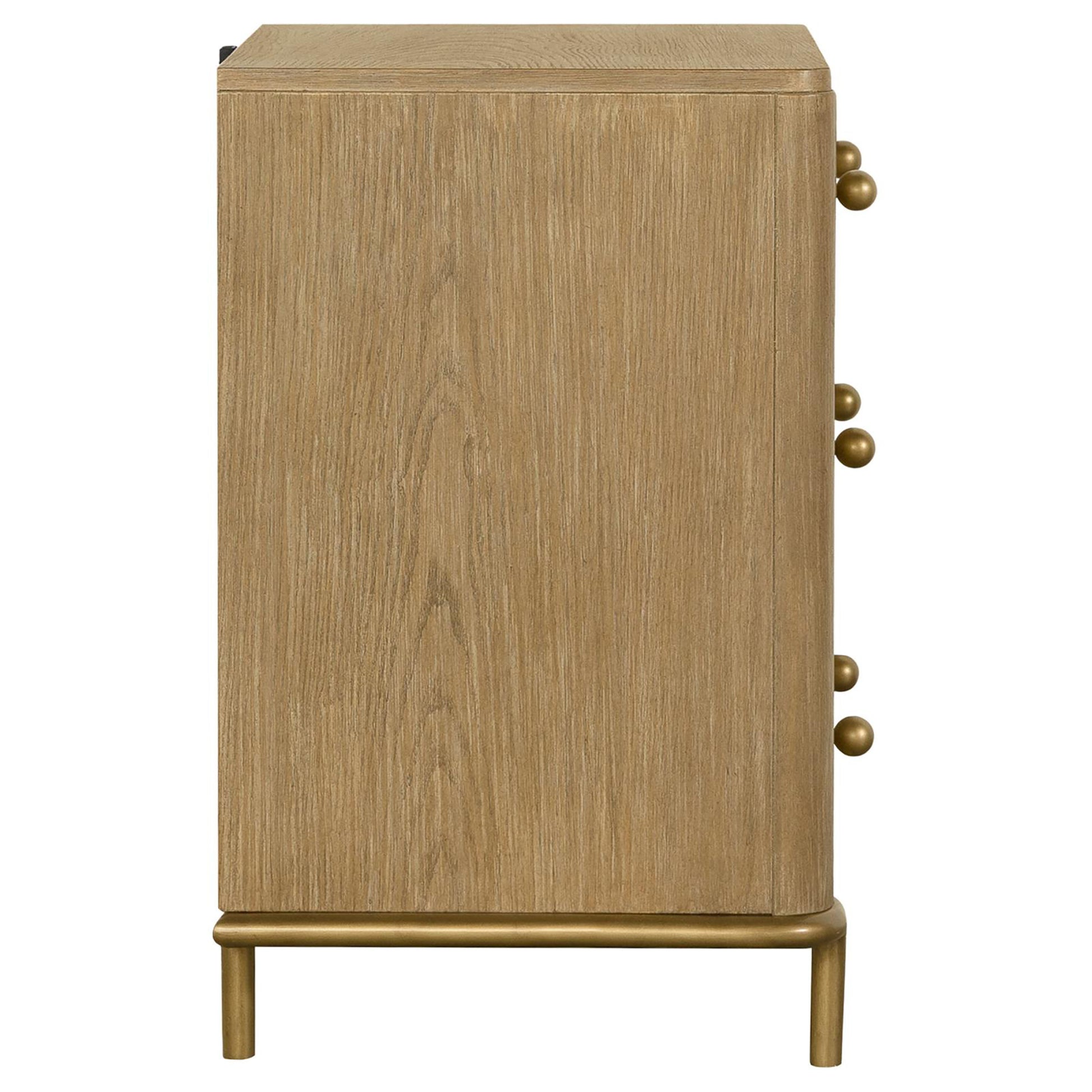 Light oak veneer dresser with four gold knob pulls and gold metal legs
