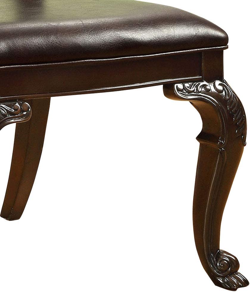 Dark brown faux leather dining chair seat with ornate carved wood legs
