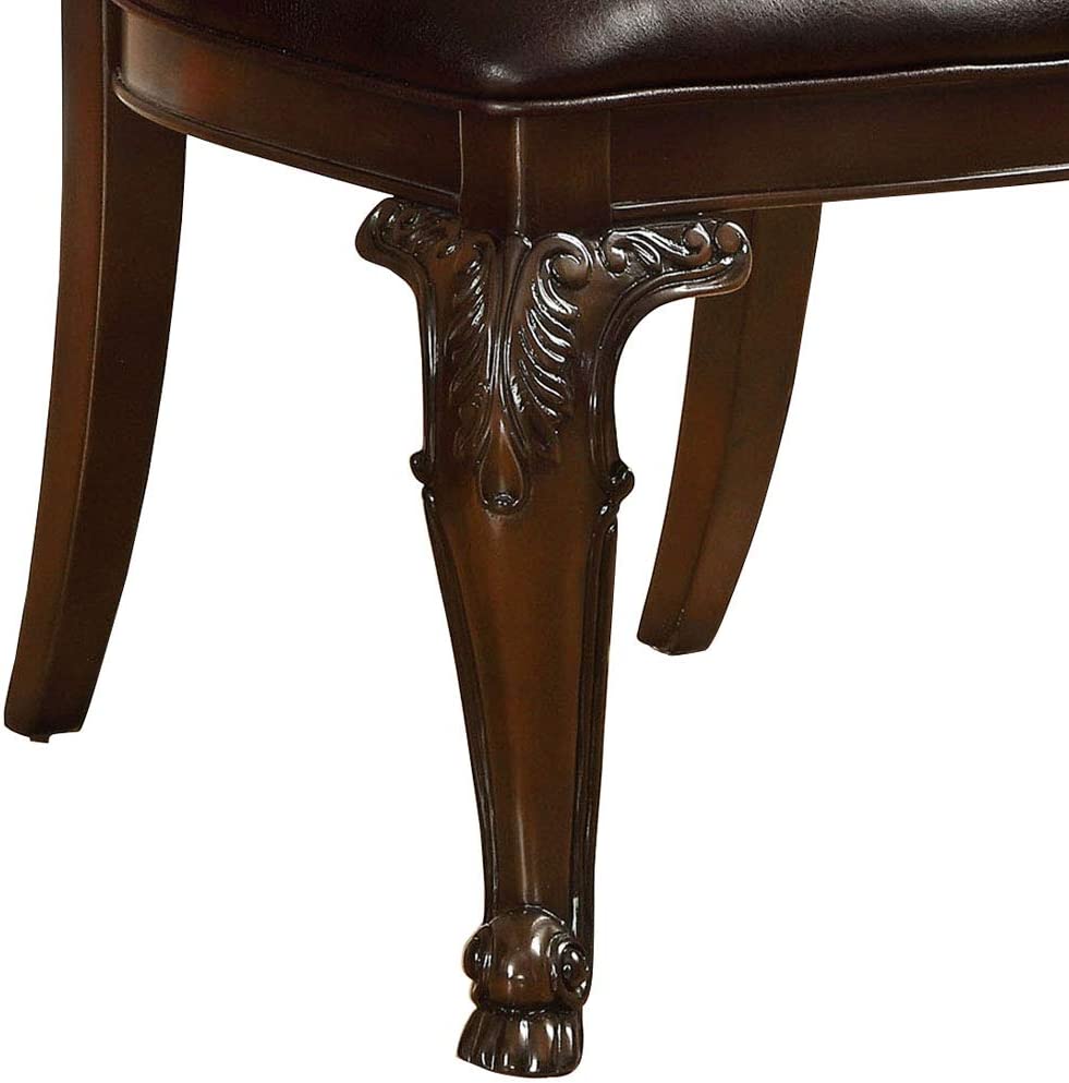 Dark mahogany ornate carved chair leg with bun foot classic dining chair detail