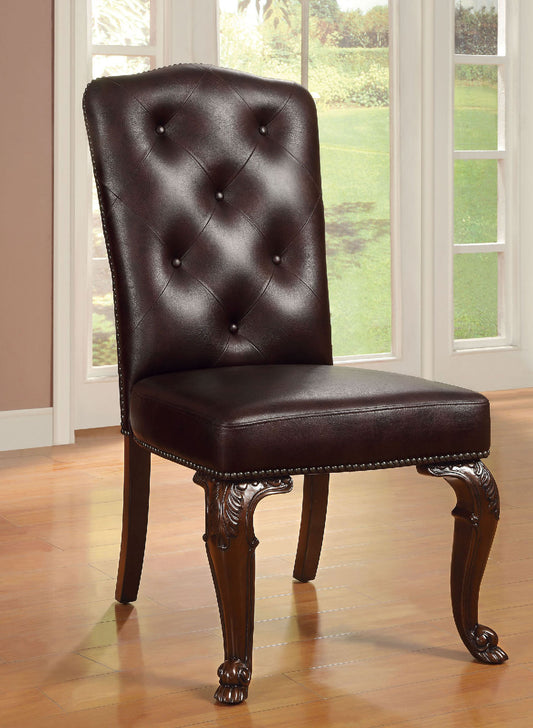Dark brown tufted leather dining chair with ornate carved wooden legs