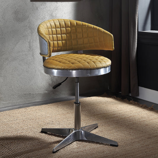 Yellow quilted leather desk chair with brushed metal accents and chrome base
