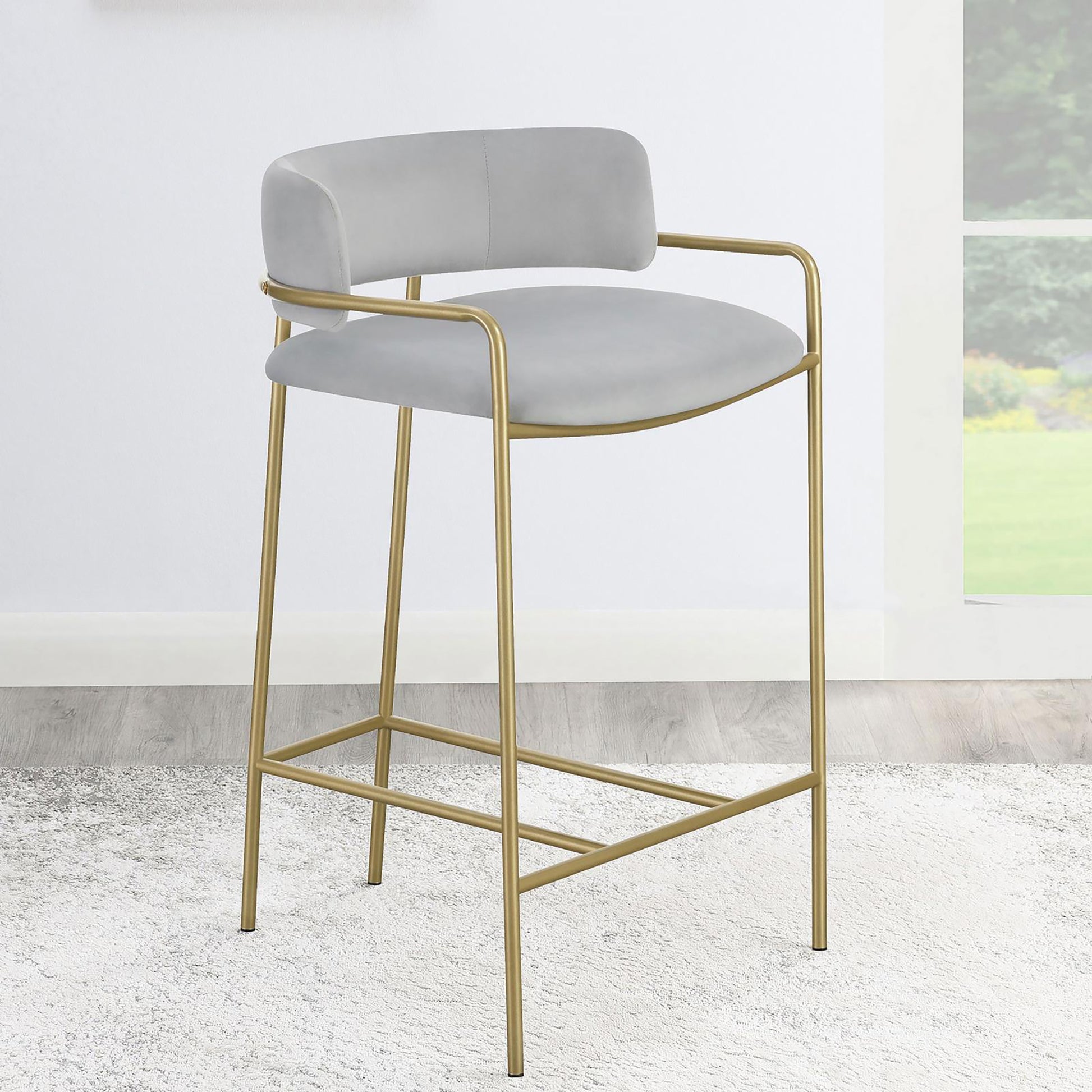 Light grey velvet bar stool with gold metal frame