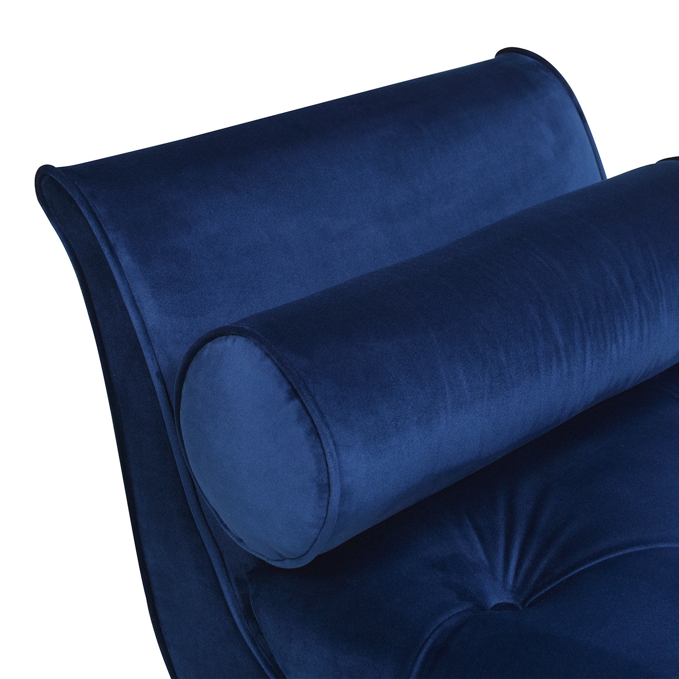 Deep blue velvet chaise lounge detail with bolster pillow
