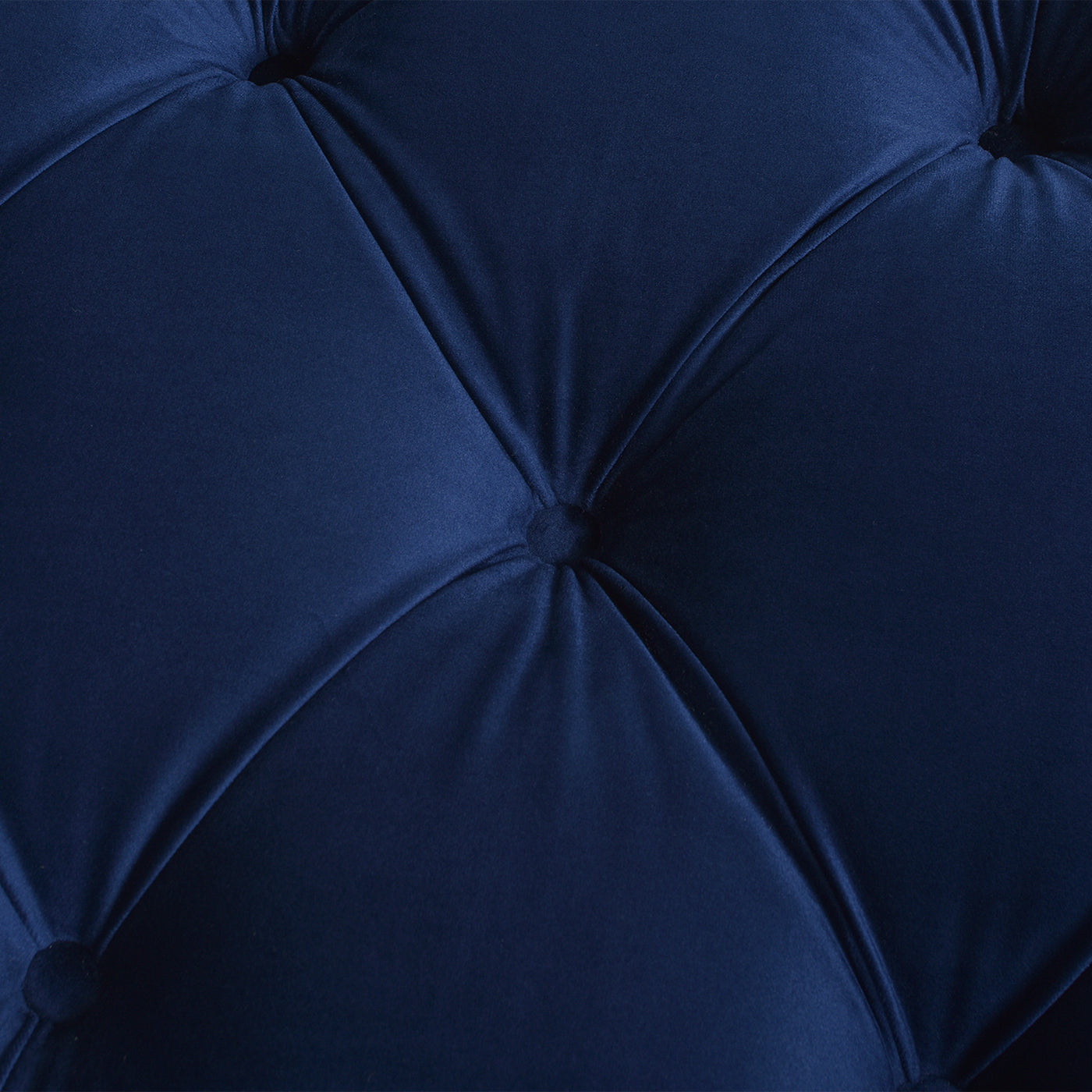 Deep blue velvet tufted fabric detail