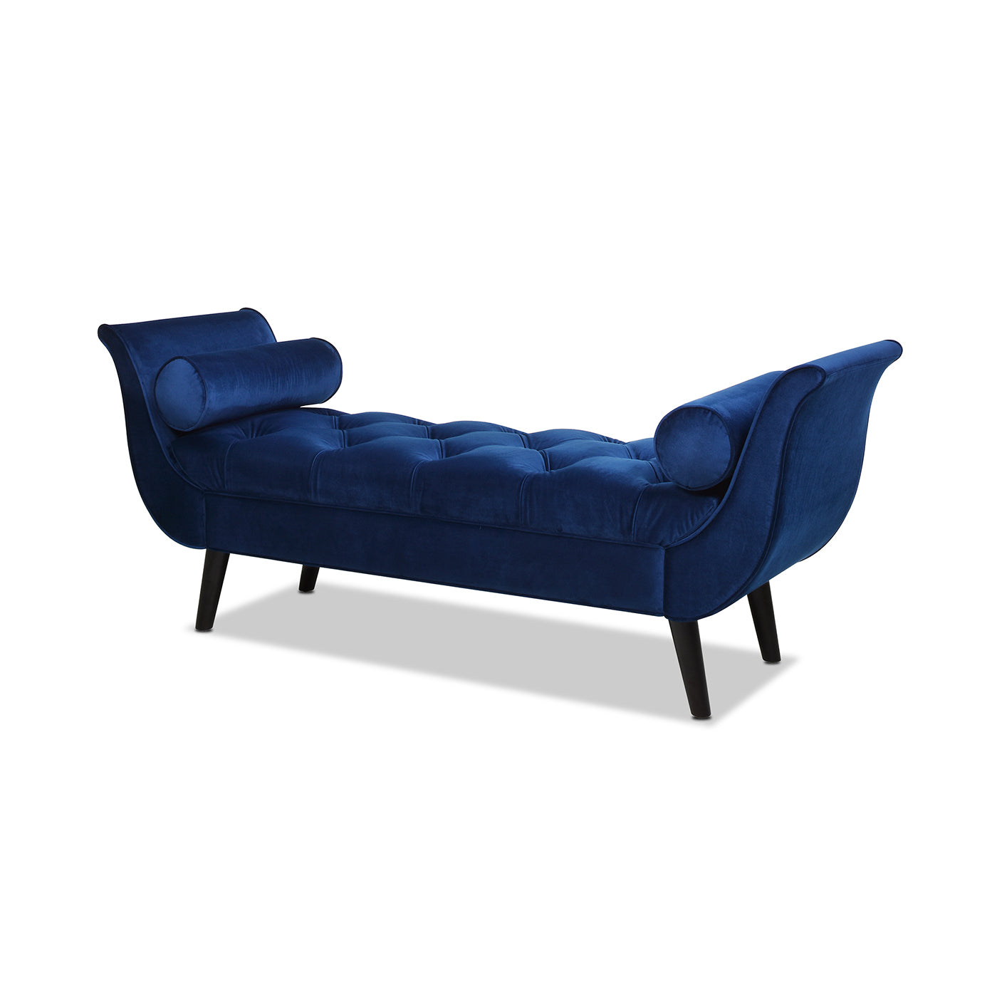 Deep blue velvet chaise lounge with tufted seat and bolster pillows