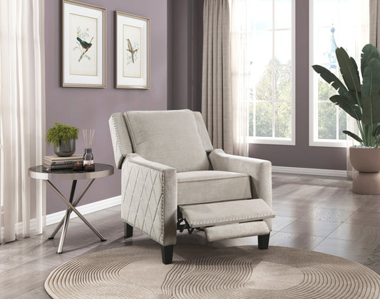 Light beige fabric recliner chair with nailhead trim and extended footrest for ultimate comfort