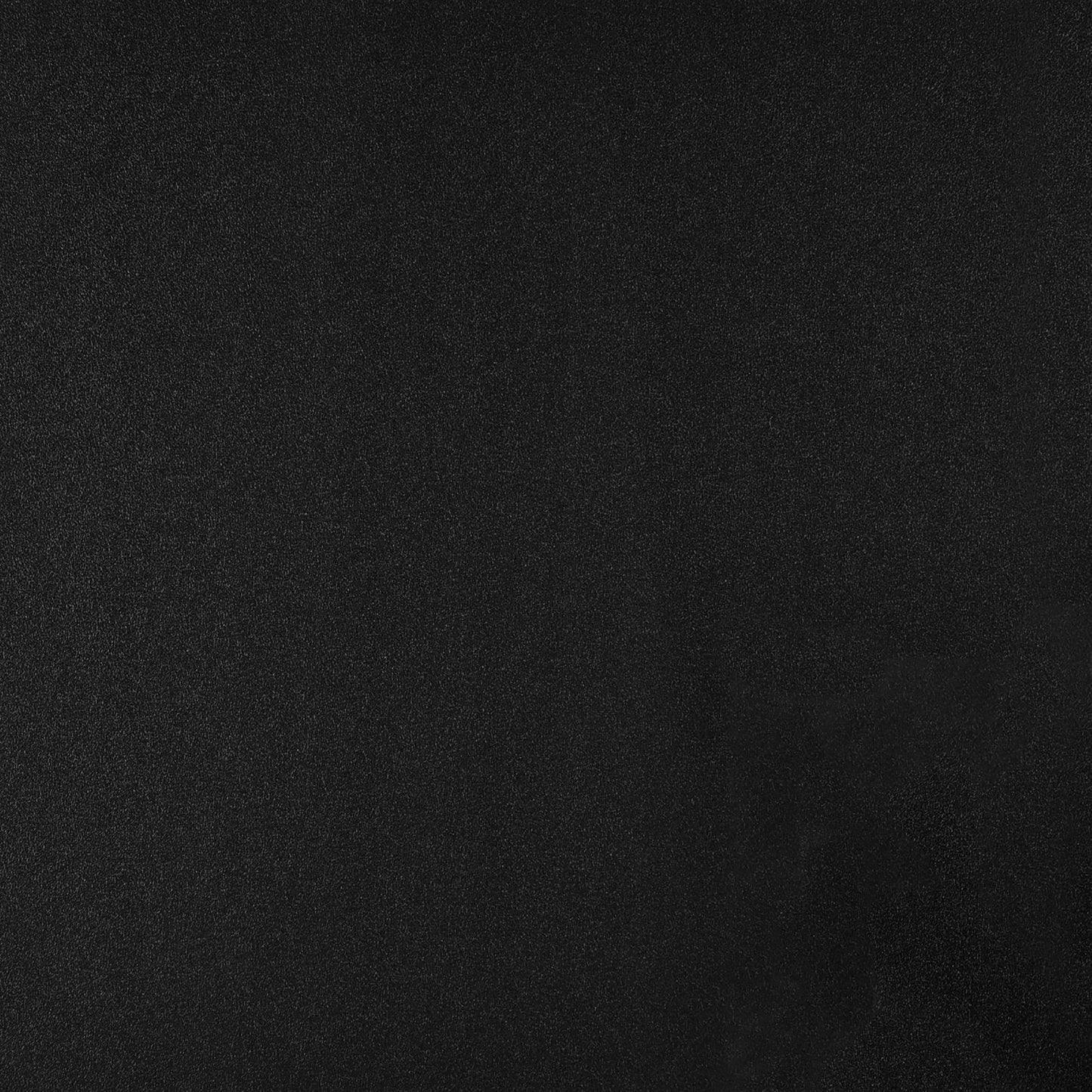 Solid black textured background with a subtle grainy finish