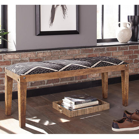 Wooden bench with black and white geometric patterned cushion  characters