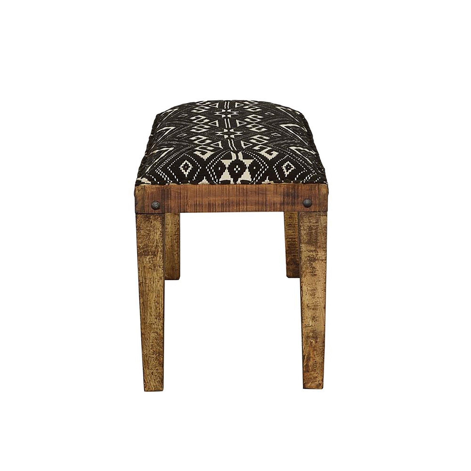 Upholstered bench with tribal pattern fabric and distressed wood legs perfect accent piece