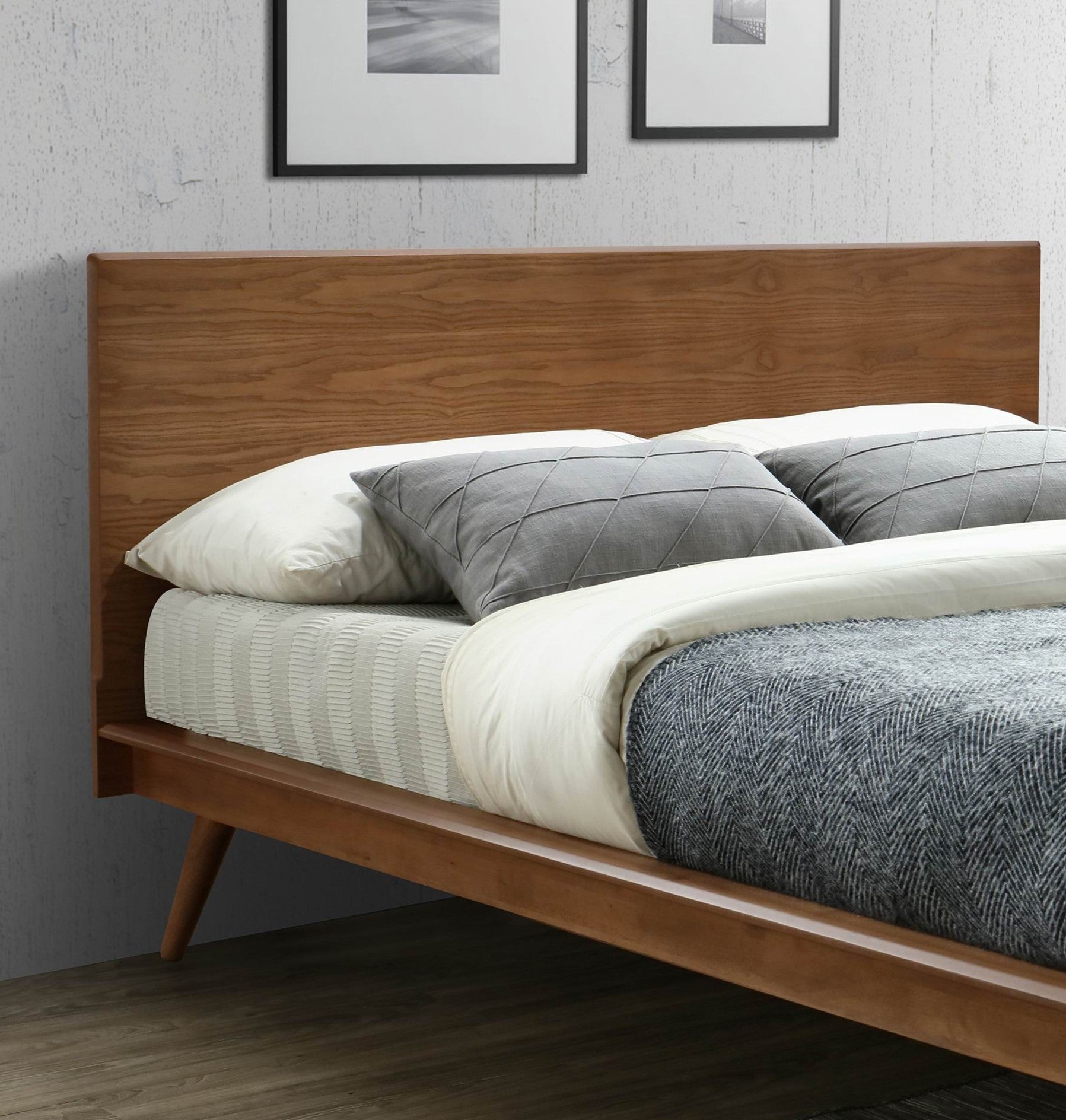 Modern midcentury wooden bed frame with slatted headboard and tapered legs