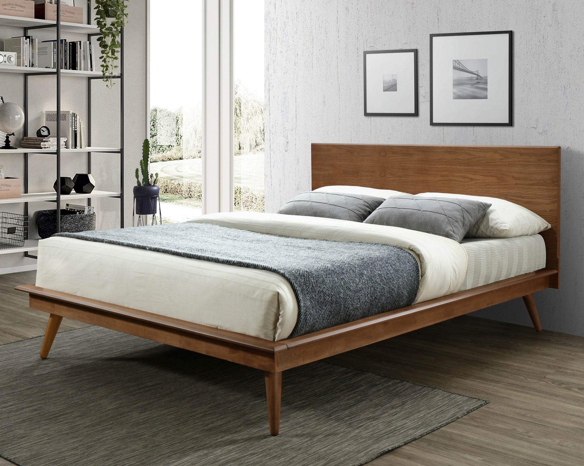 Midcentury modern wooden platform bed with queen size mattress and grey throw