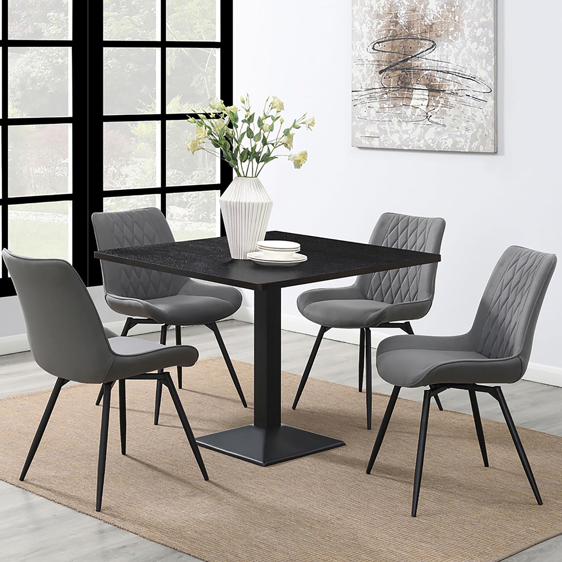 Modern black square dining table with four grey upholstered chairs