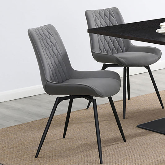 Grey upholstered dining chair with diamond tufting and black metal legs