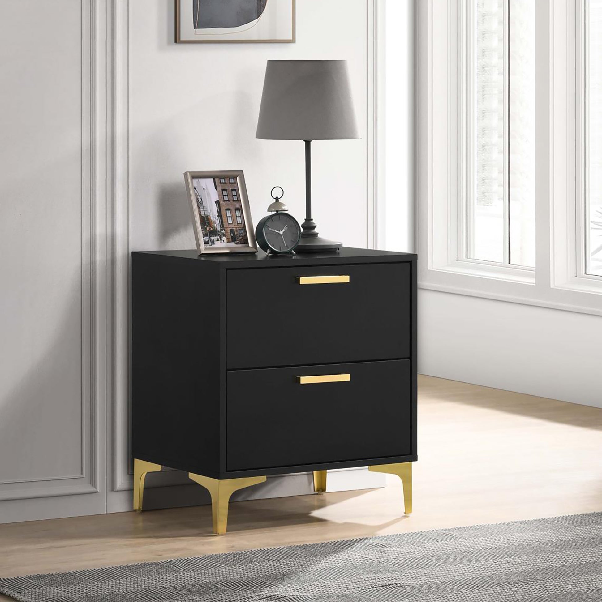 Black modern nightstand with two drawers and gold legs perfect for bedroom storage