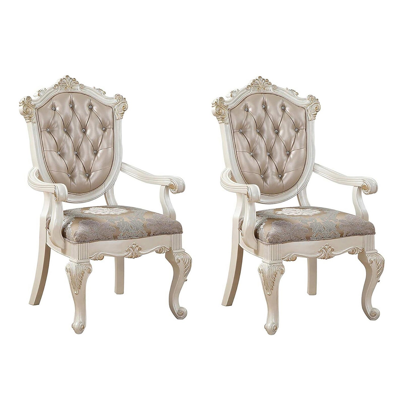 Pair of cream upholstered dining chairs with tufted back and carved wood legs