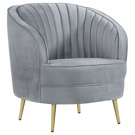 Plush grey velvet accent chair with channel tufting and gold tapered legs