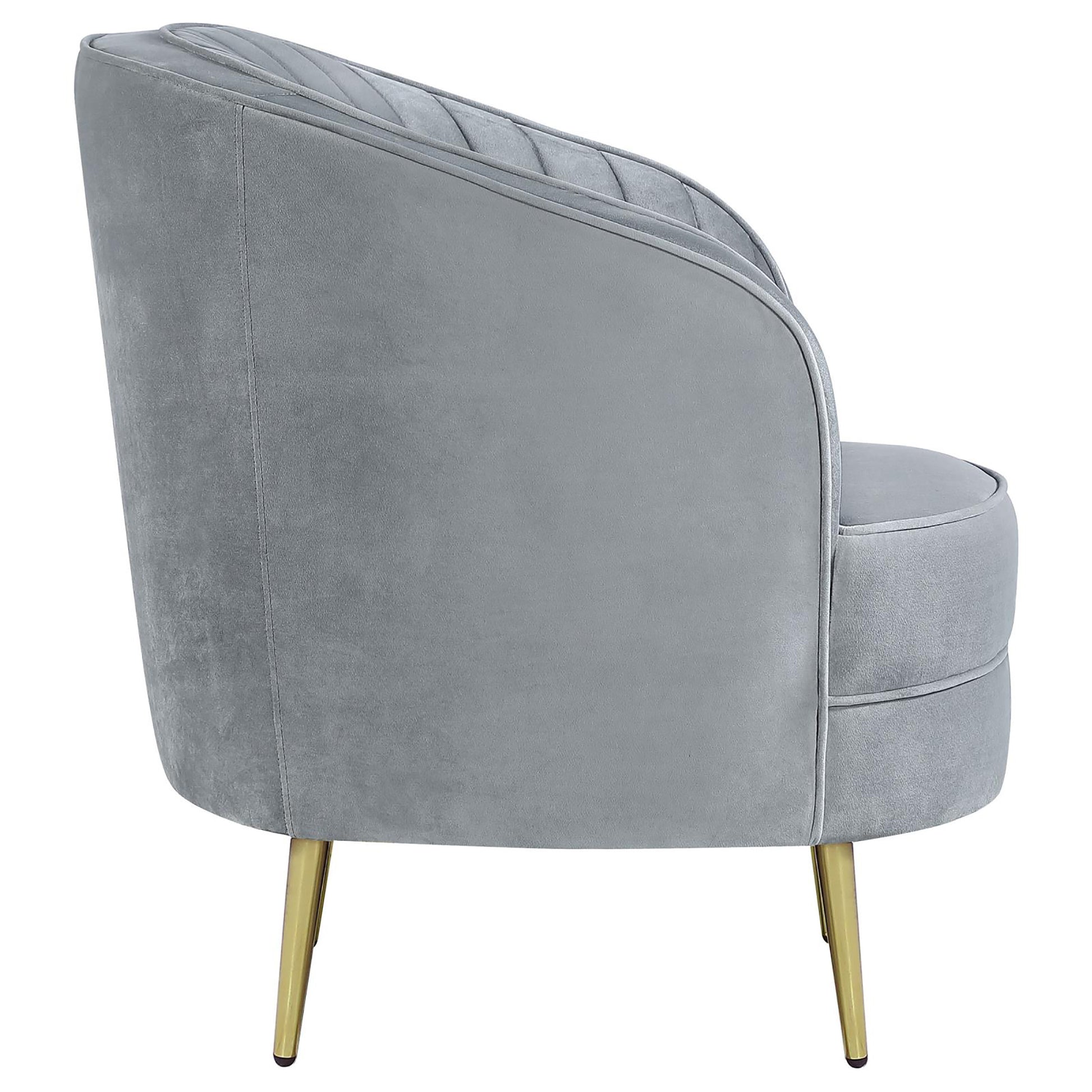 Grey velvet accent chair with channel tufting and gold metal legs