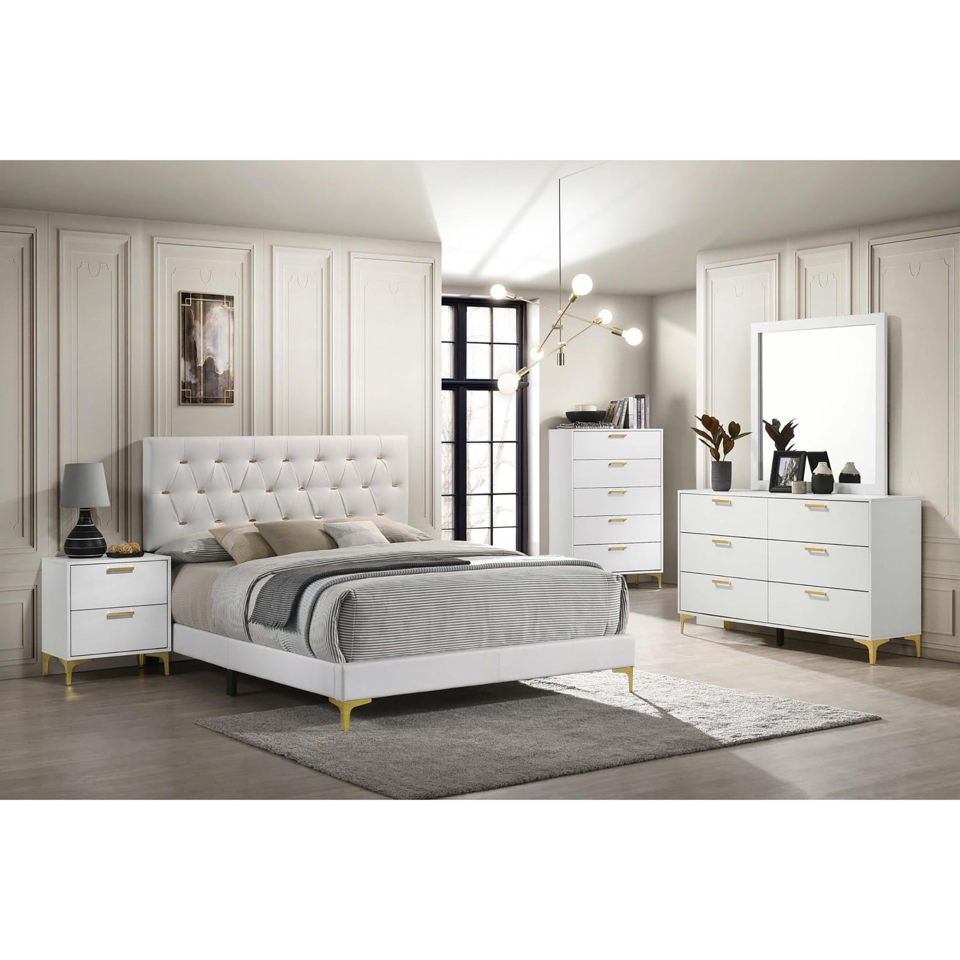 White tufted upholstered platform bed with gold accents and striped bedding