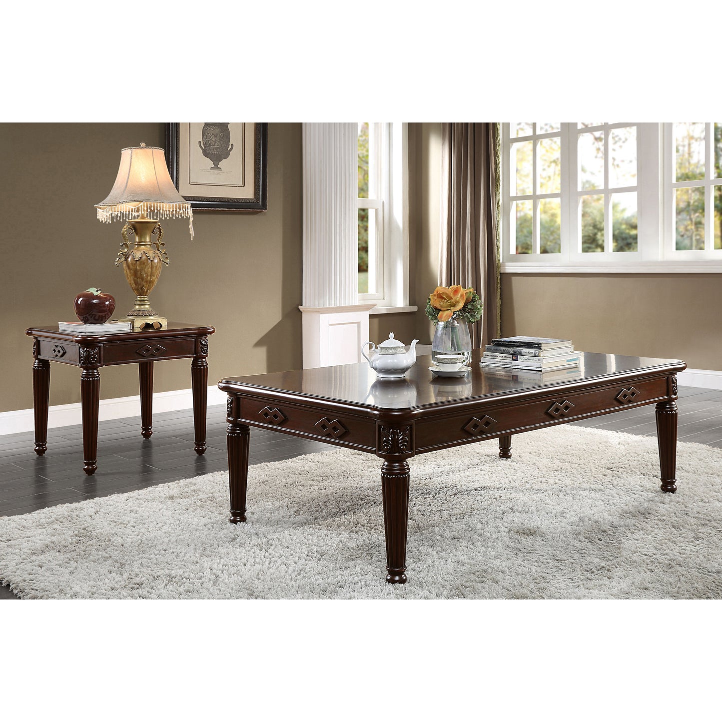 Ornate dark wood coffee table with carved details and fluted legs