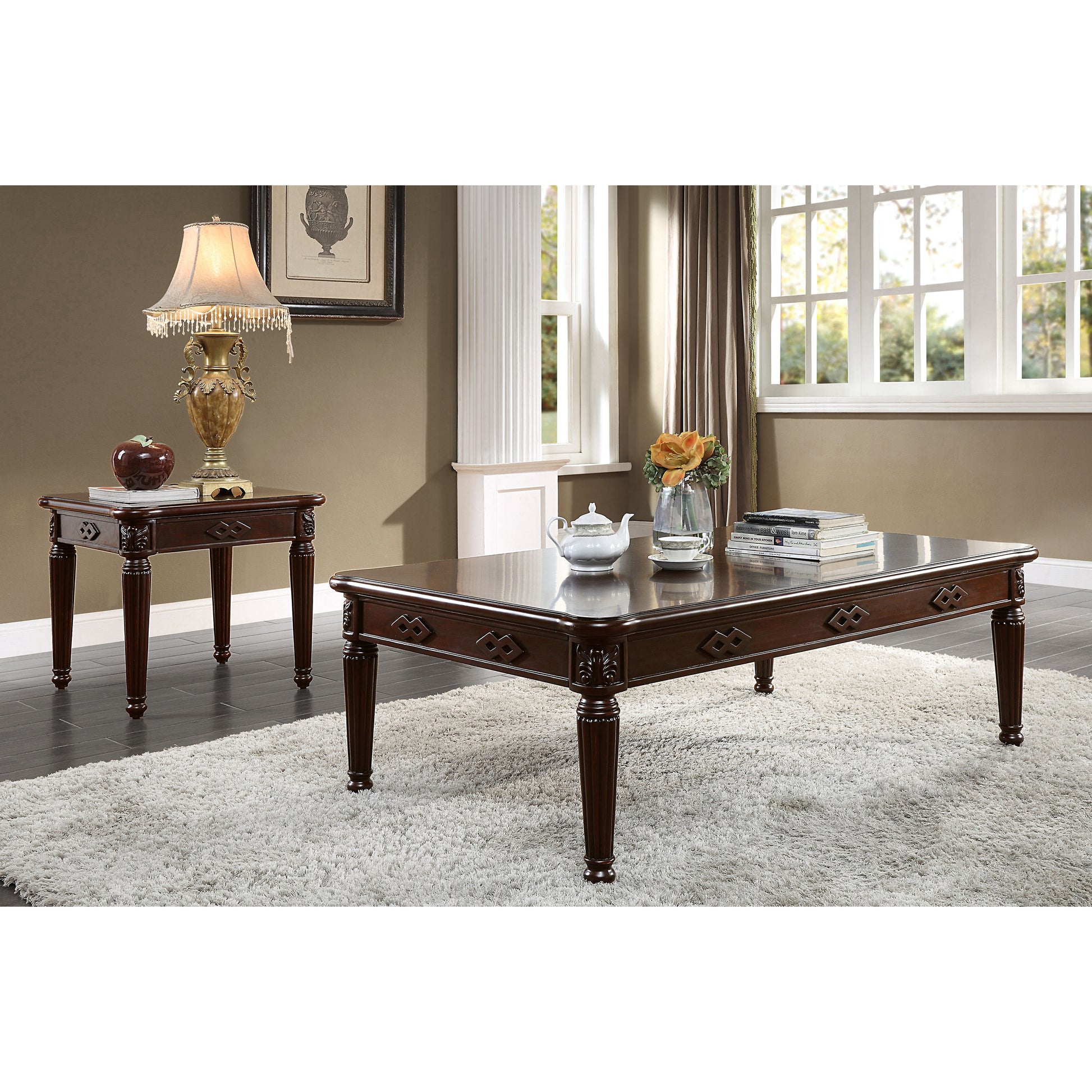 Ornate dark wood coffee table with carved details and fluted legs