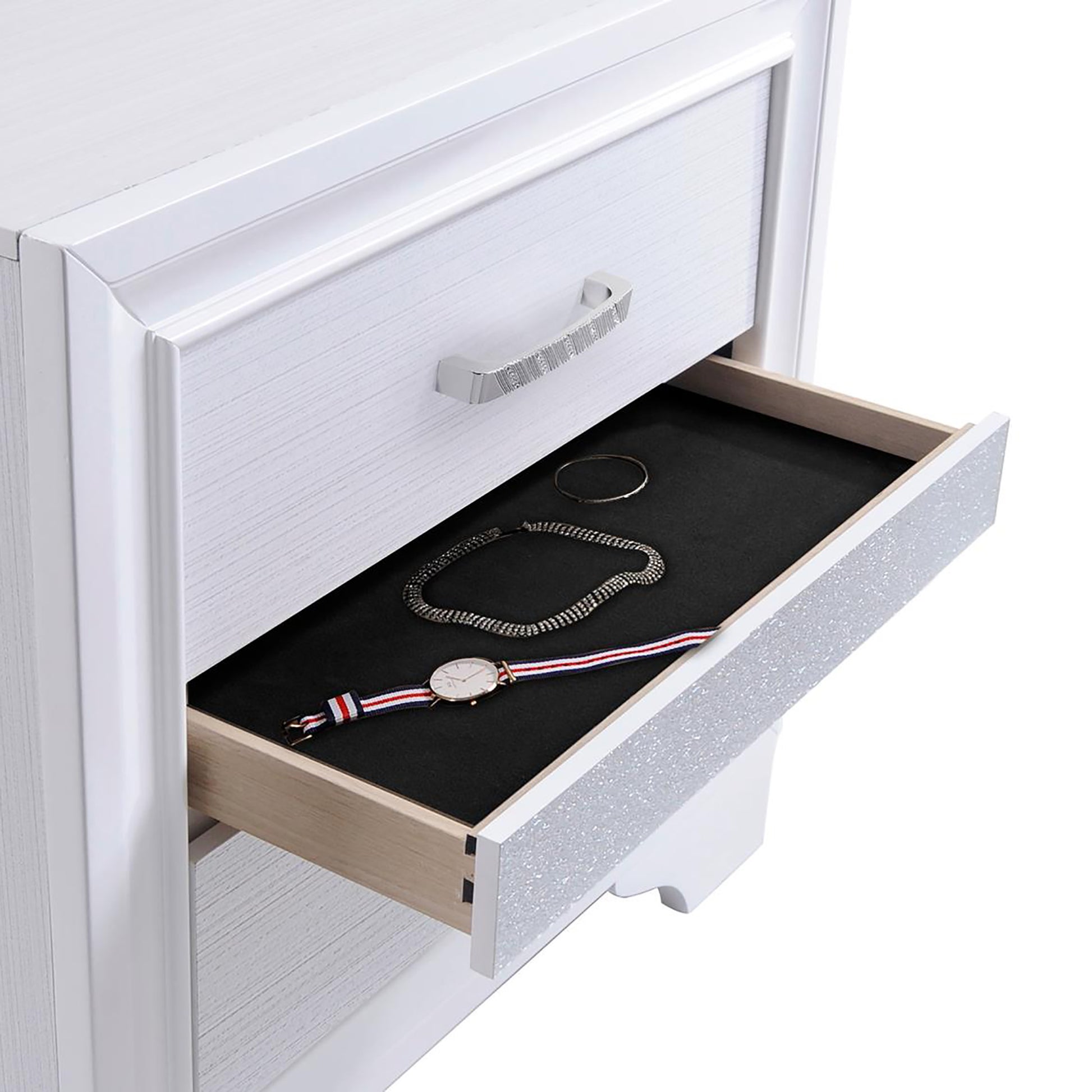 White dresser drawer open with necklace watch and bracelet inside