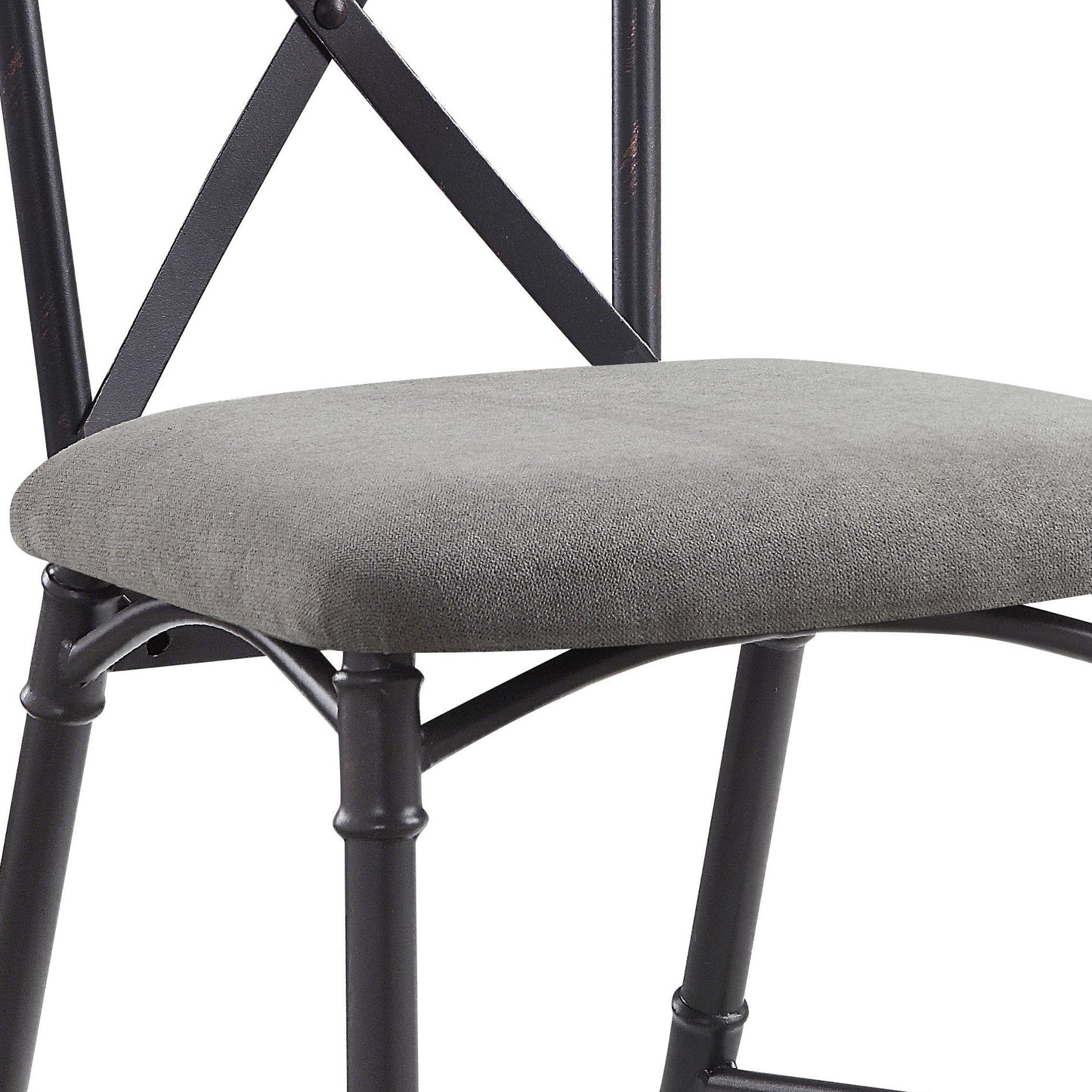 Closeup of upholstered gray seat on a rustic black metal chair with X back design