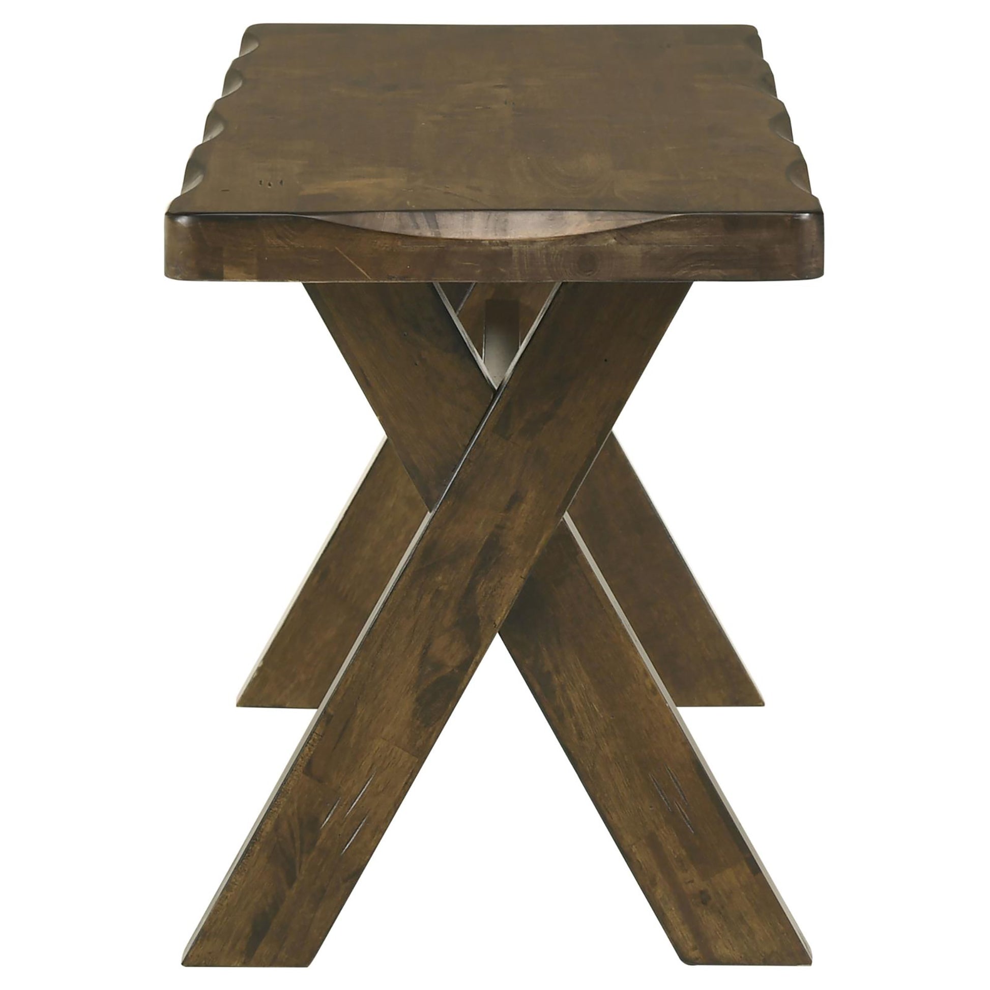 Rustic dark brown wooden bench with crossed legs