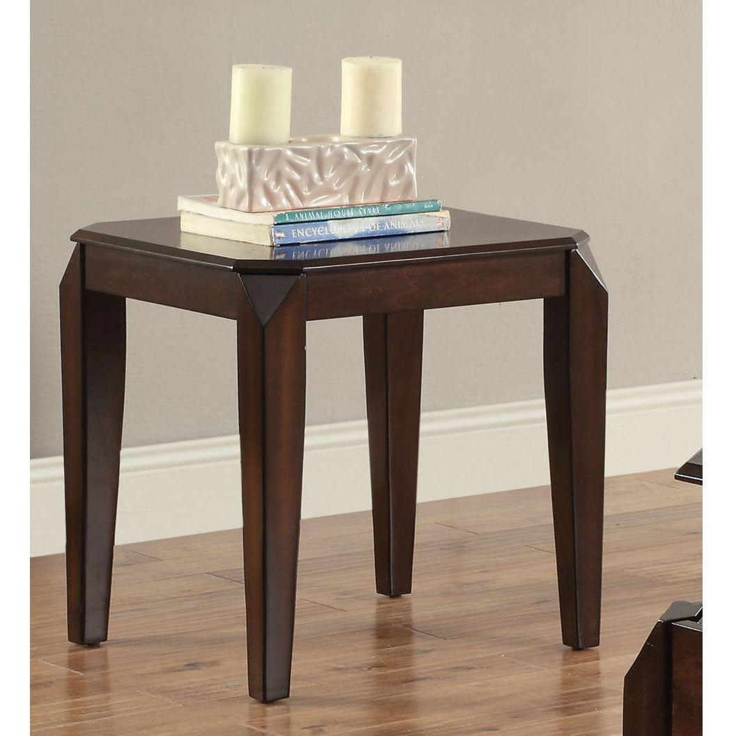 Dark wood end table with tapered legs and decorative inlay on top holding candles