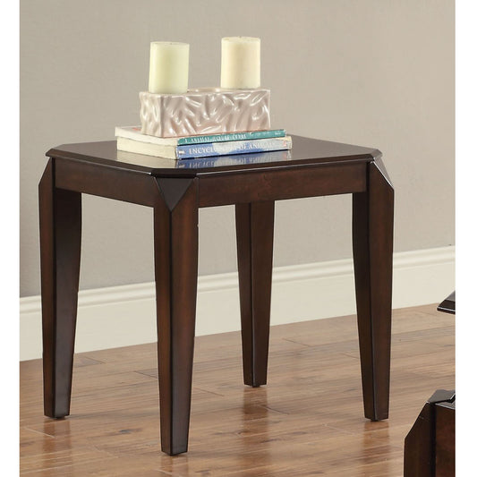 Dark wood end table with tapered legs and decorative inlay on top holding candles