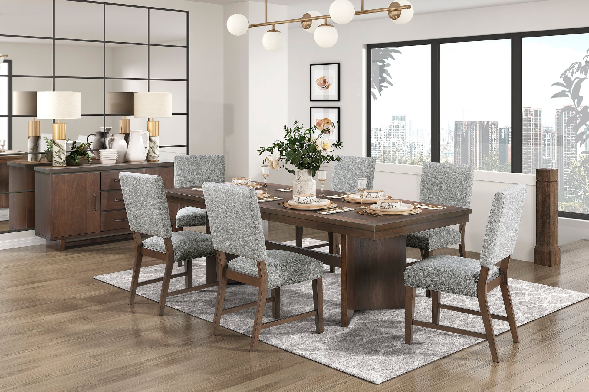 Dark wood dining table with six grey upholstered chairs set for a meal with place settings and floral centerpiece