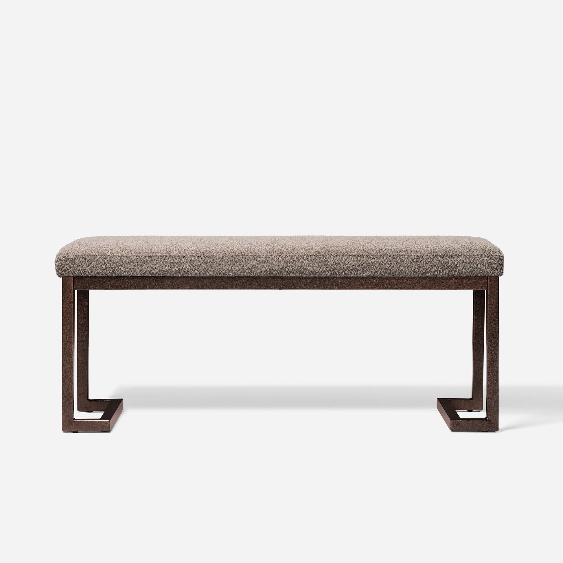Textured beige upholstered bench with modern dark bronze metal frame