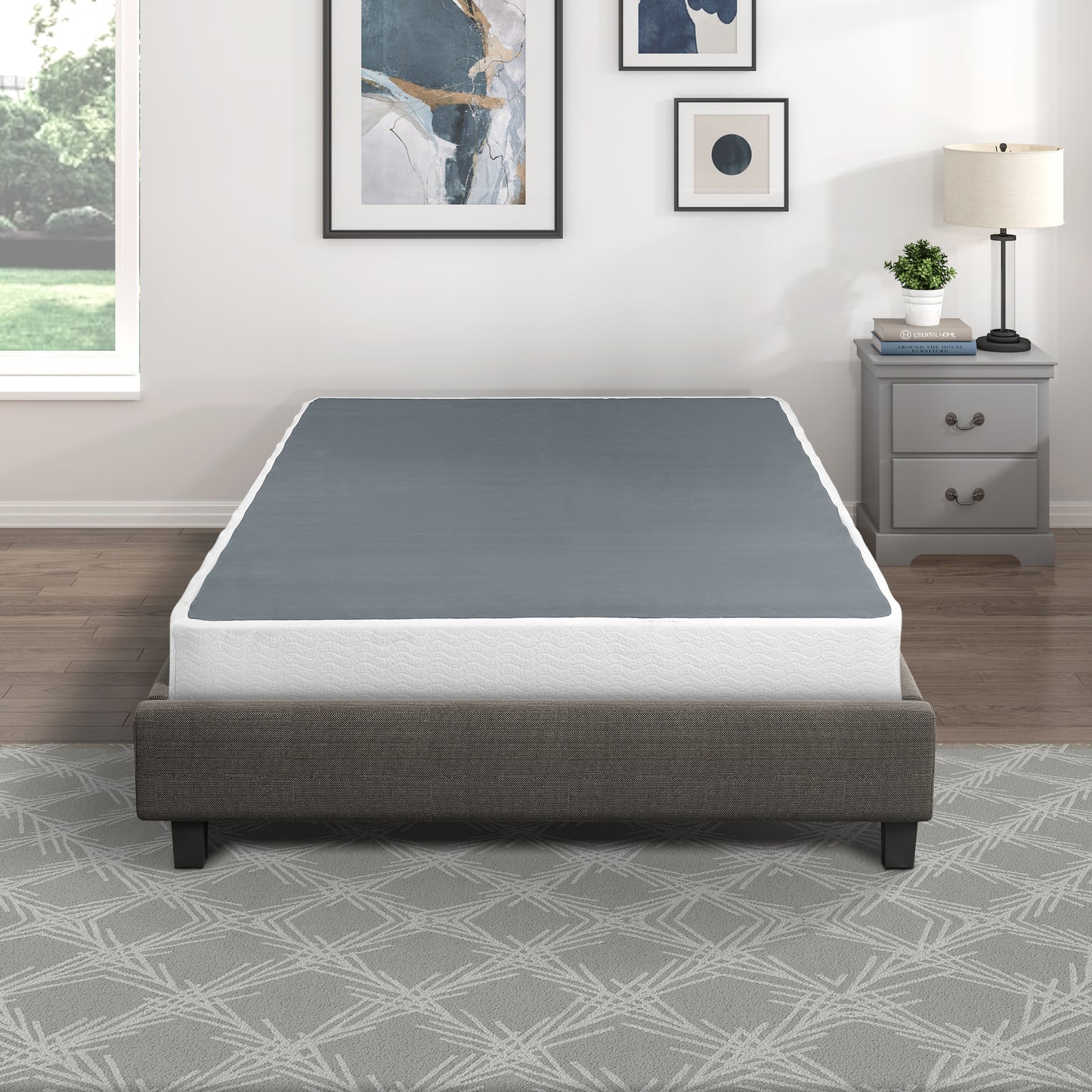 Grey metal bed frame with white mattress and grey mattress cover