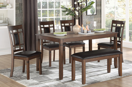 Dark oak dining table with four upholstered chairs and a bench set for a meal