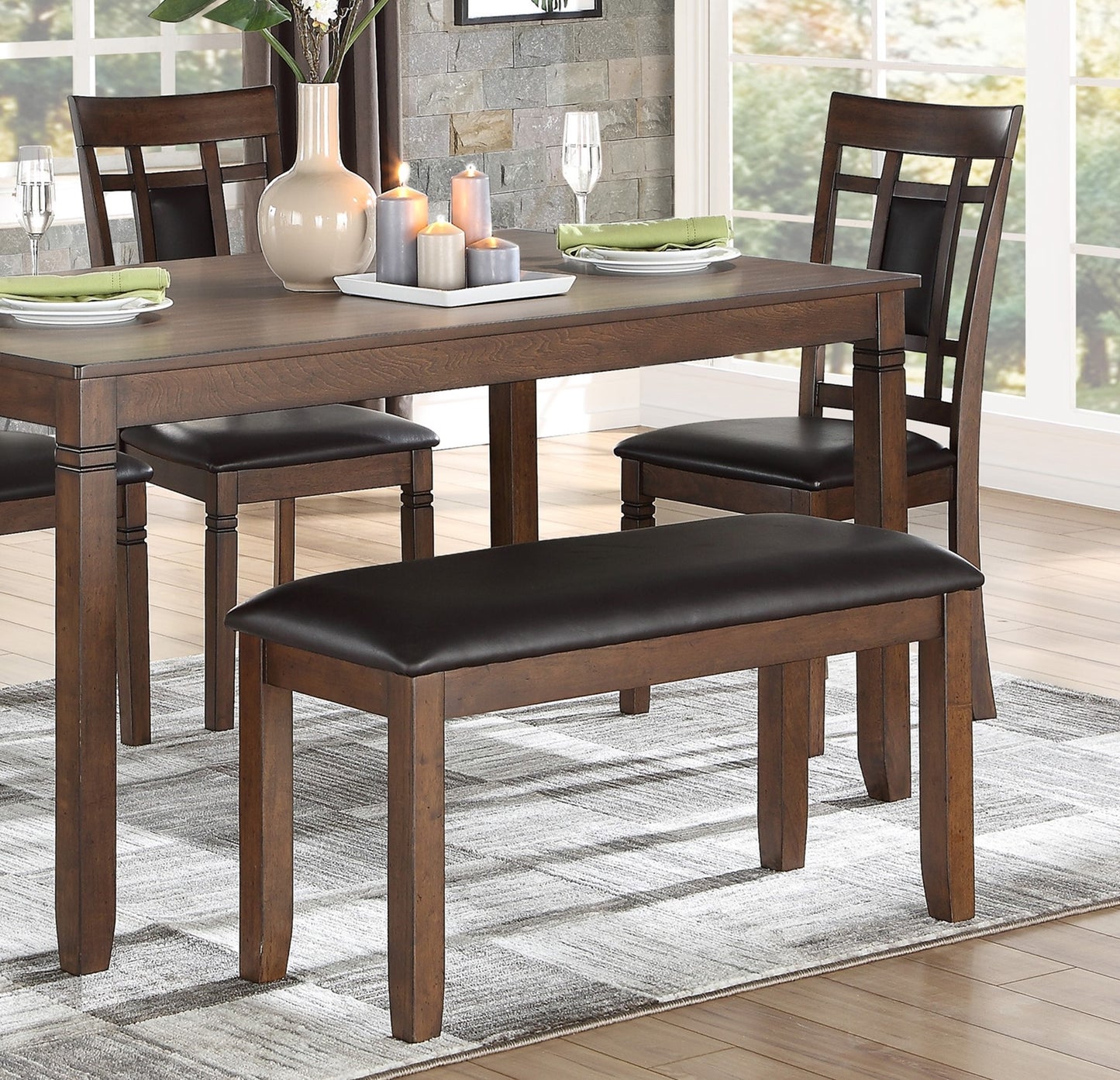 Dark wood dining bench with black faux leather seat