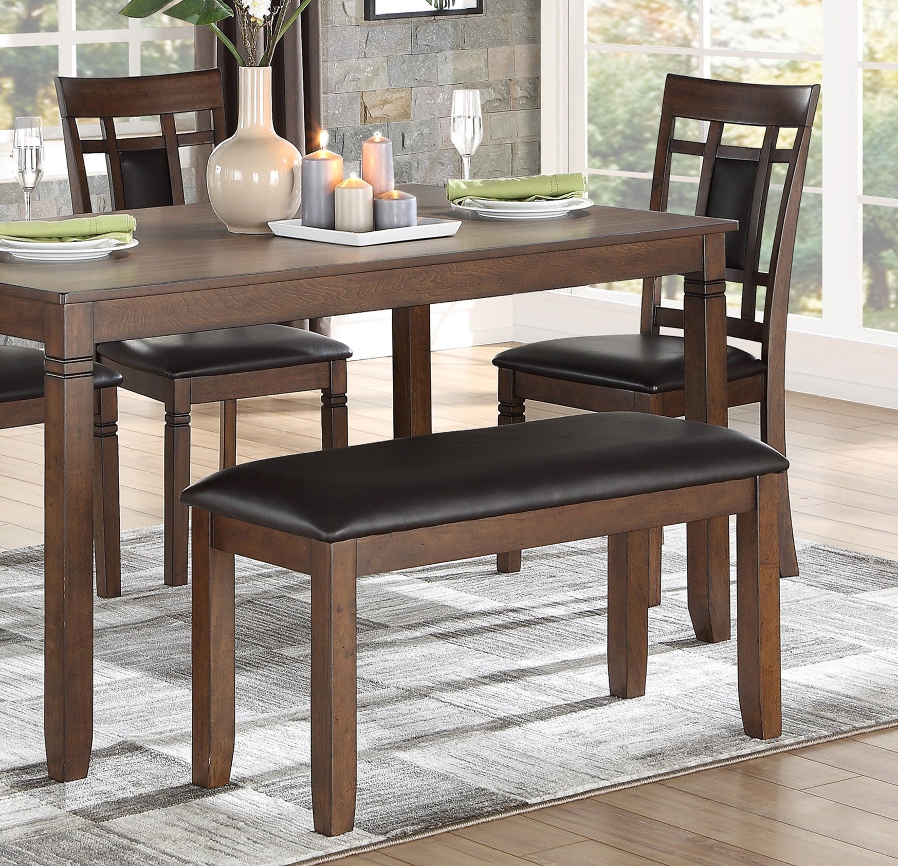 Dark wood dining bench with black faux leather seat
