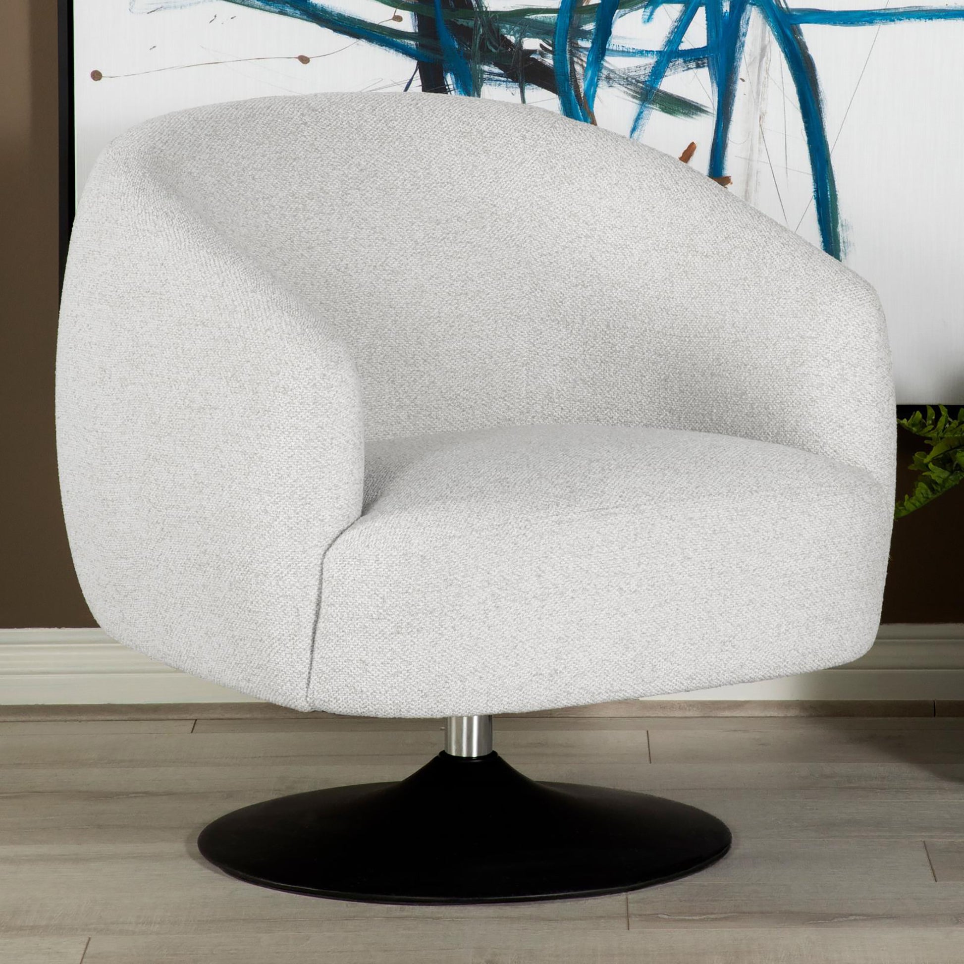 Light gray upholstered accent chair with modern curved silhouette and black swivel base