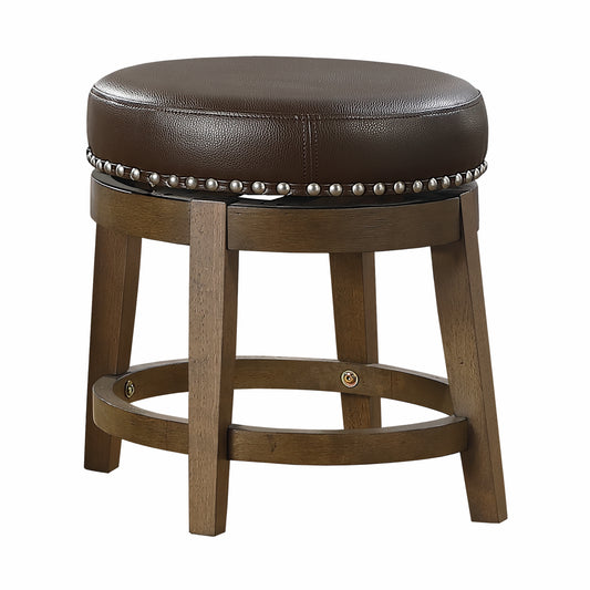 Brown faux leather swivel stool with nailhead trim and dark wood base