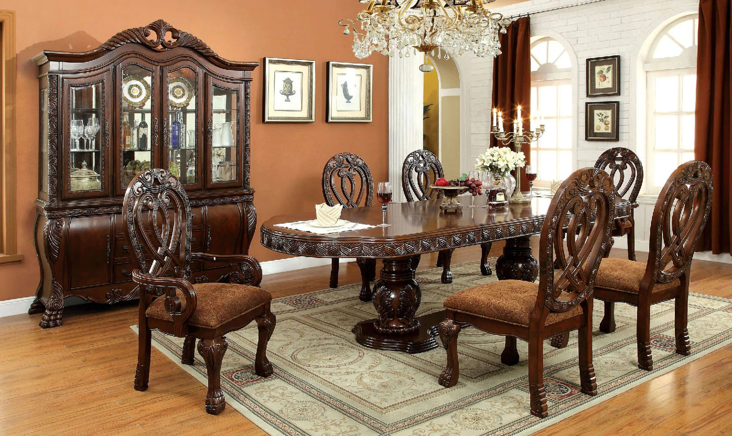 Ornate mahogany dining table with carved legs and six matching chairs