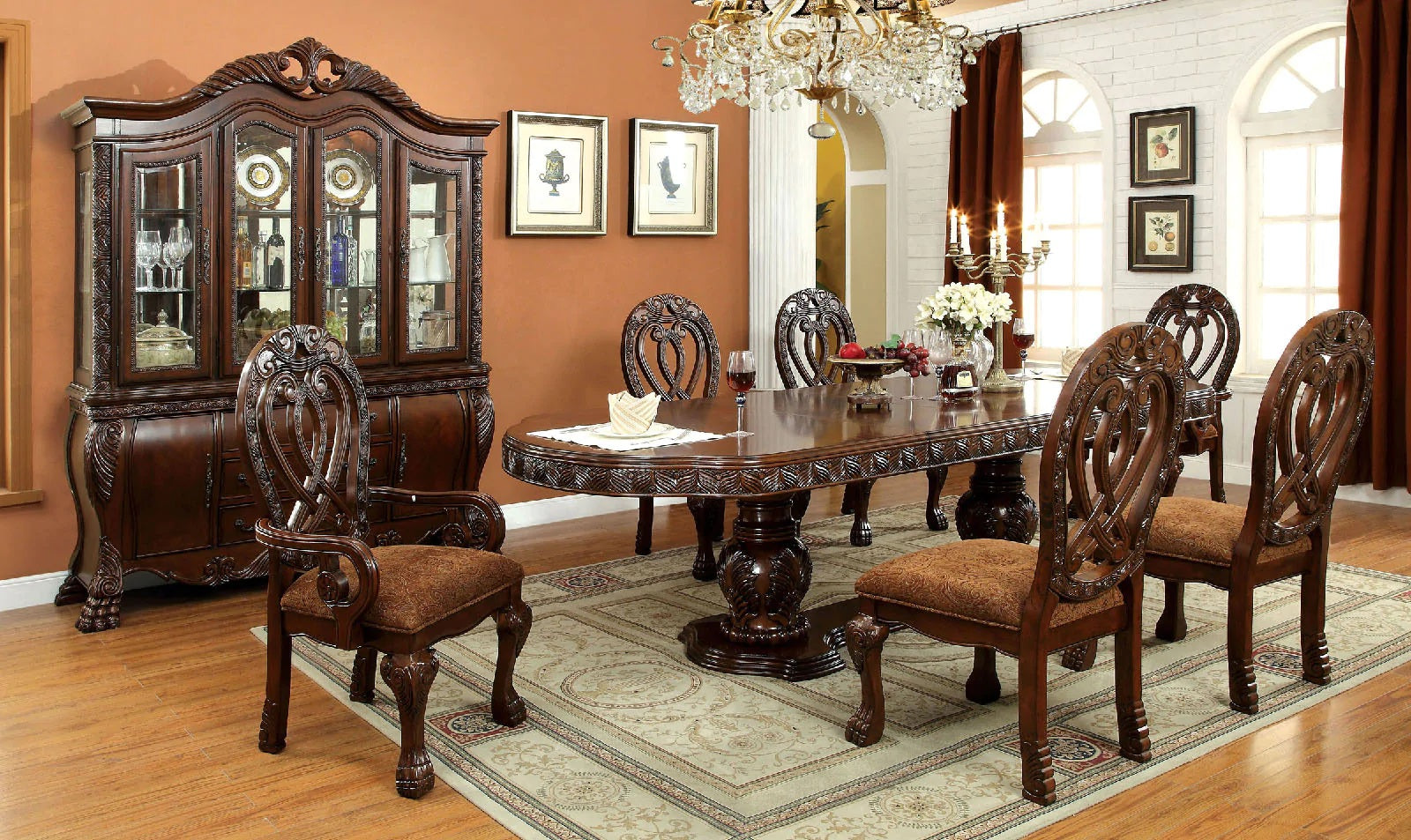 Ornate mahogany dining table with carved legs and six matching chairs