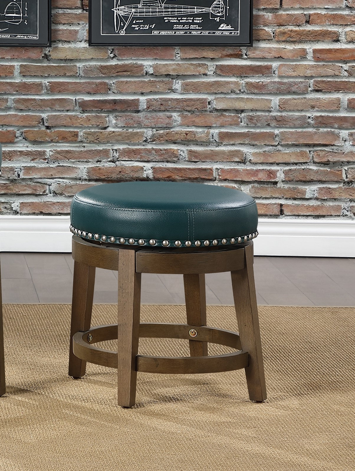 Teal upholstered swivel stool with silver nailhead trim and distressed wood legs