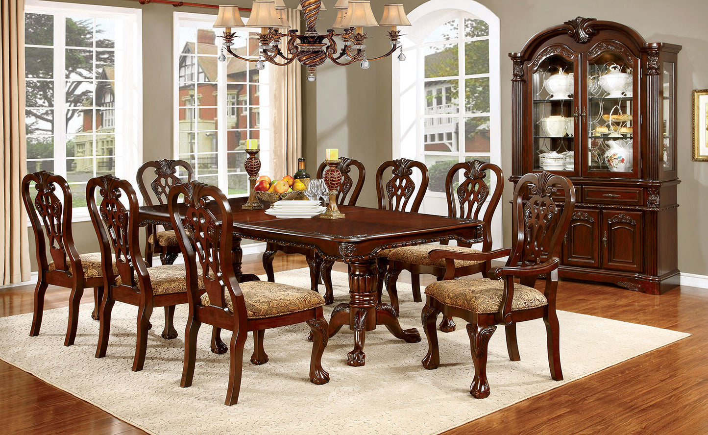 Elegant mahogany dining table with ornate carvings and cushioned chairs seats eight
