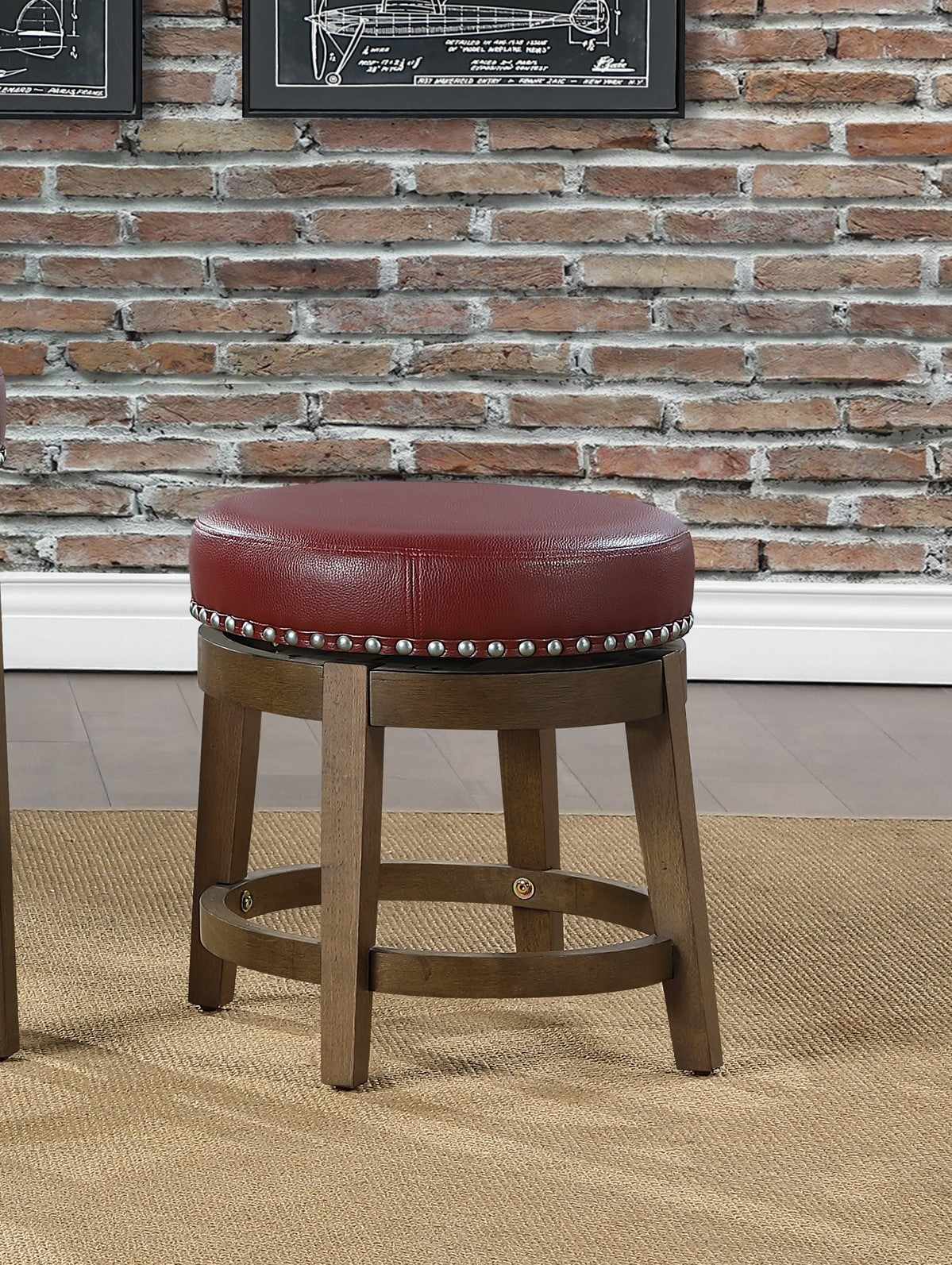 Red leather swivel bar stool with nailhead trim and wooden legs