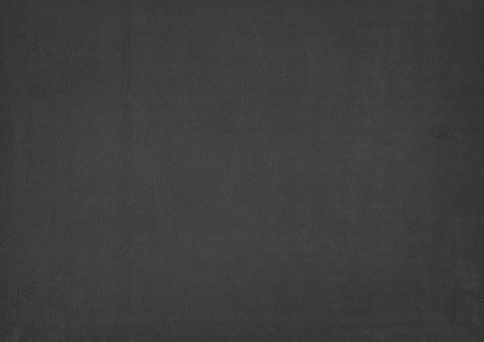 Dark charcoal grey textured background fabric for upholstery projects