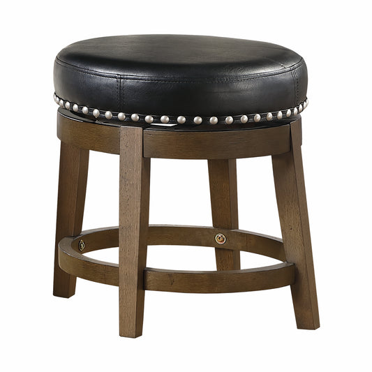Round black leather bar stool with silver nailhead trim and wooden legs